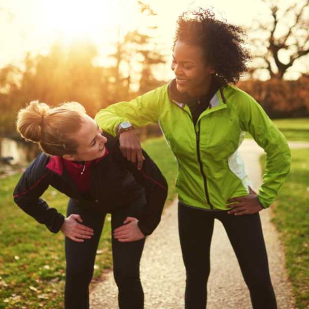 two happy women on cardio jog