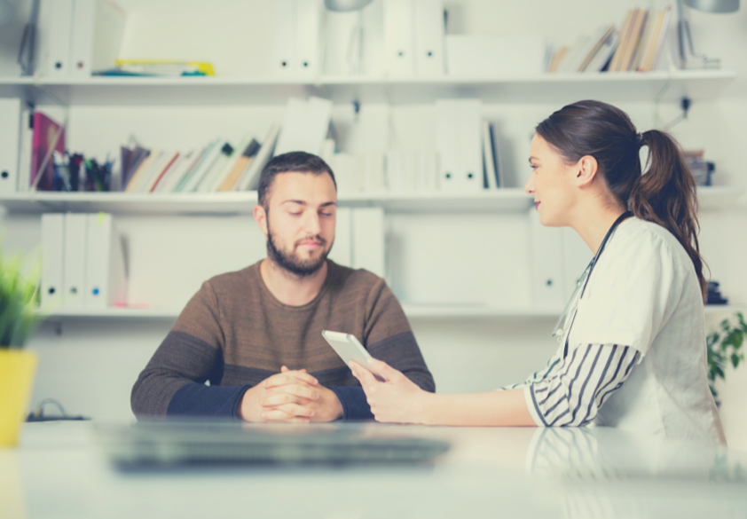 man meeting with doctor at appointment
