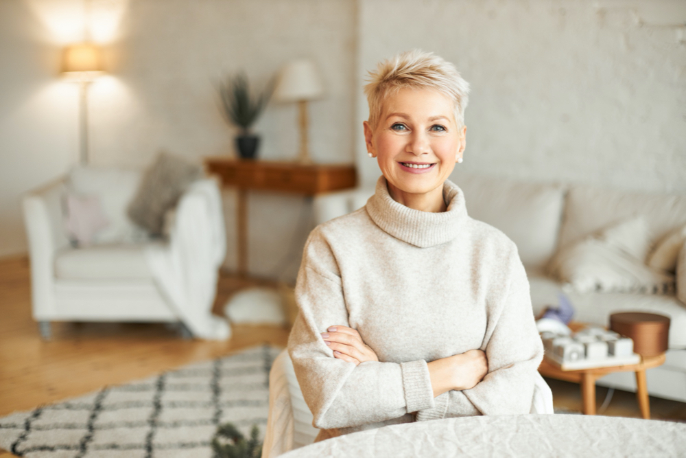 photo people, coziness, domesticity and season concept. charming beautiful retired woman spending leisure time 