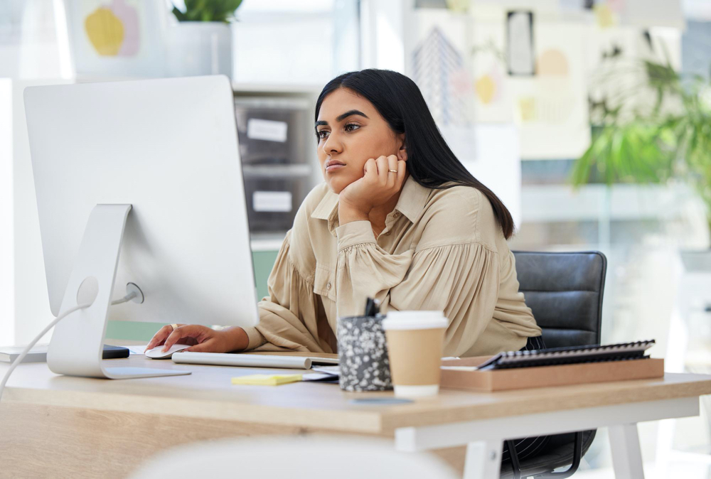 Photo thinking attention and business woman on computer working by desk in design company office building idea vision 